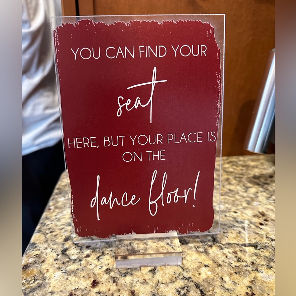 “You can find your seat here but your place is on the dance floor” Acrylic Sign